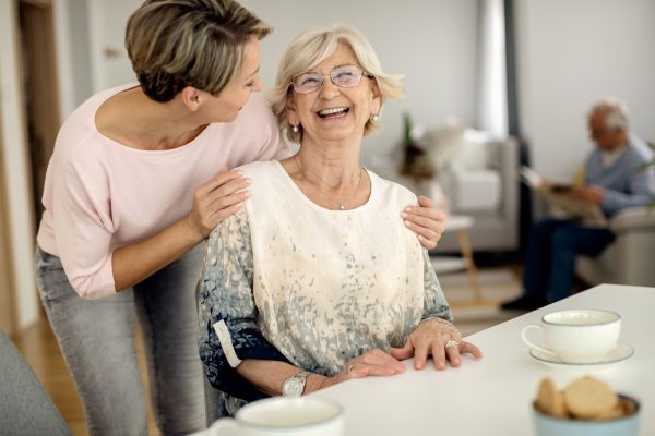 cheerful-senior-woman-having-fun-with-her-adult-daughter-home